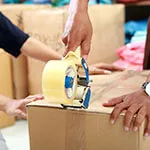 package Sealing a carton of linens for shipment