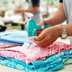 Attaching custom hang tags to printed towels