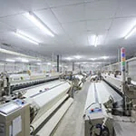 fabric-weaving Fabric weaving sheds with rows of looms