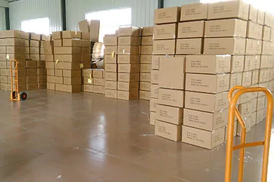 warehouse- Warehouse with stacked cartons of linens
