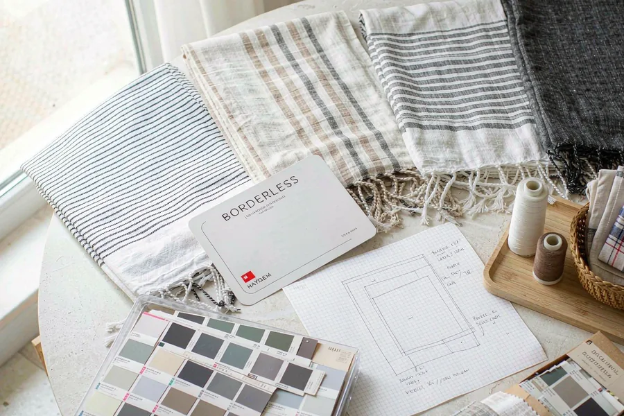 Peshtemal towel designs and colour swatches laid out for a custom order